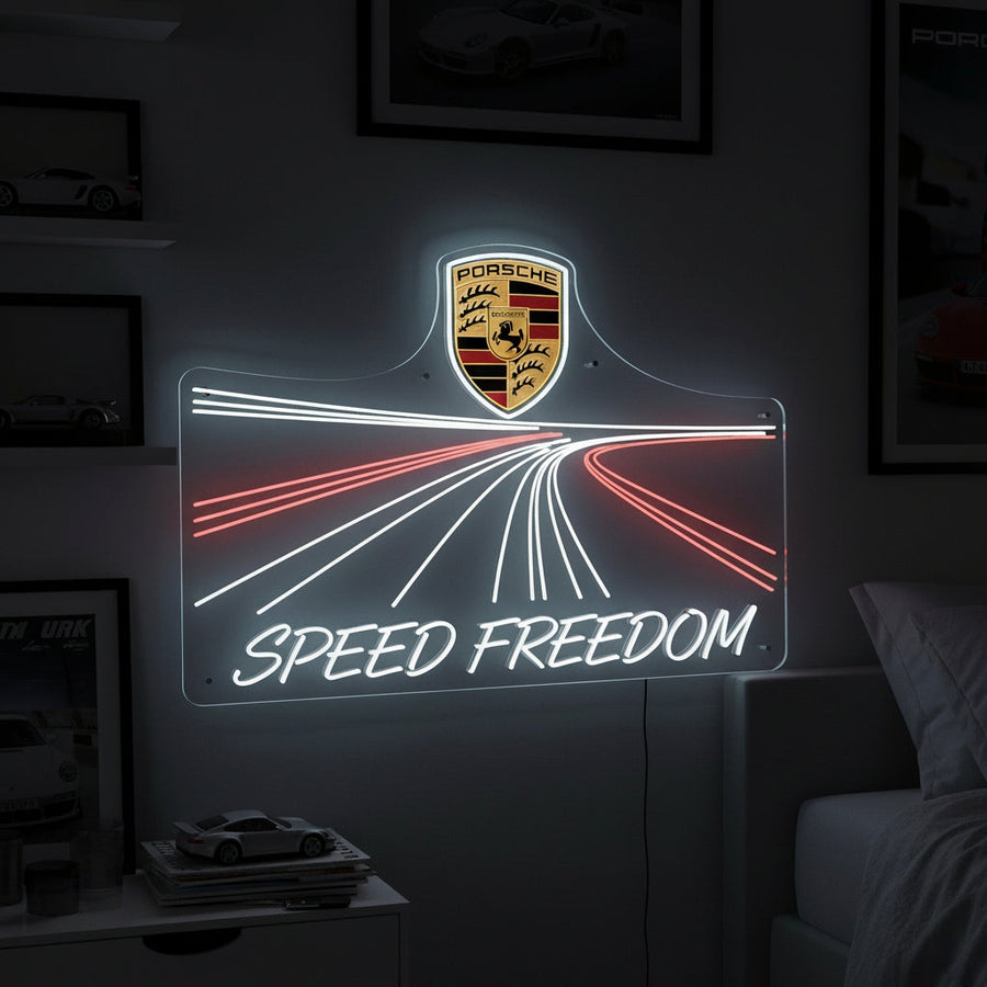 Neon sign with Porsche crest, road lines, and “Speed Freedom” text, sleek design for luxury car fans.