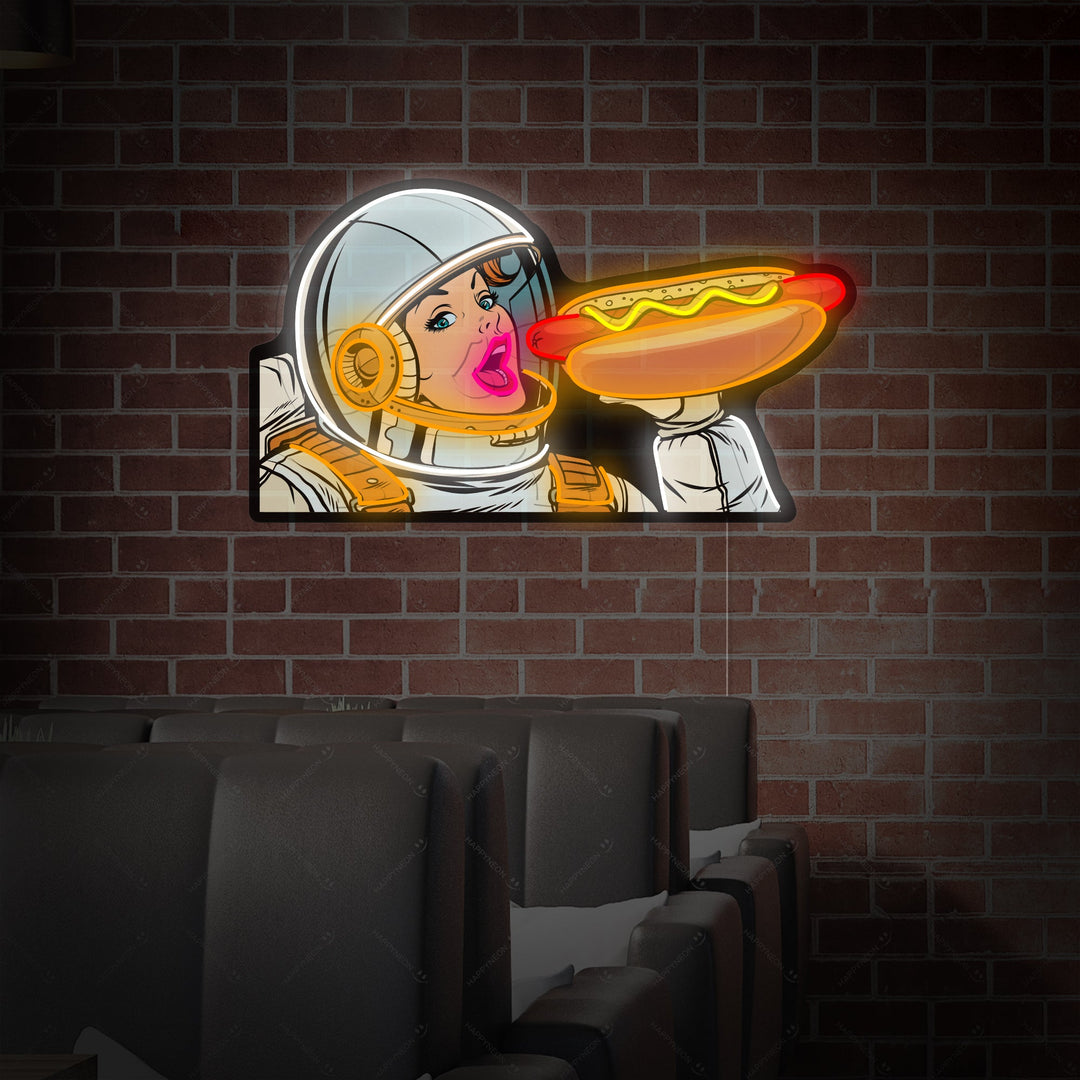 "Kvindelig astronaut spiser hotdog" Neonskilt